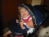 Hannah plays in her doll's stroller